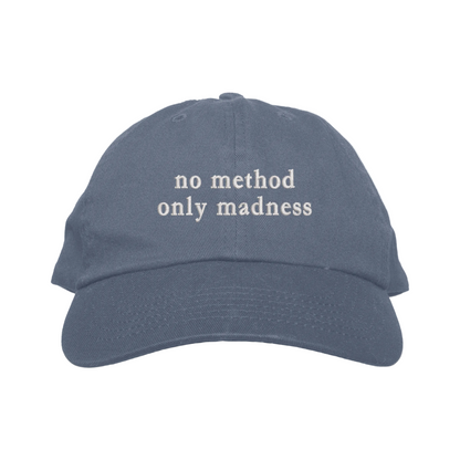 Blue cap with 'no method only madness' text on a white background