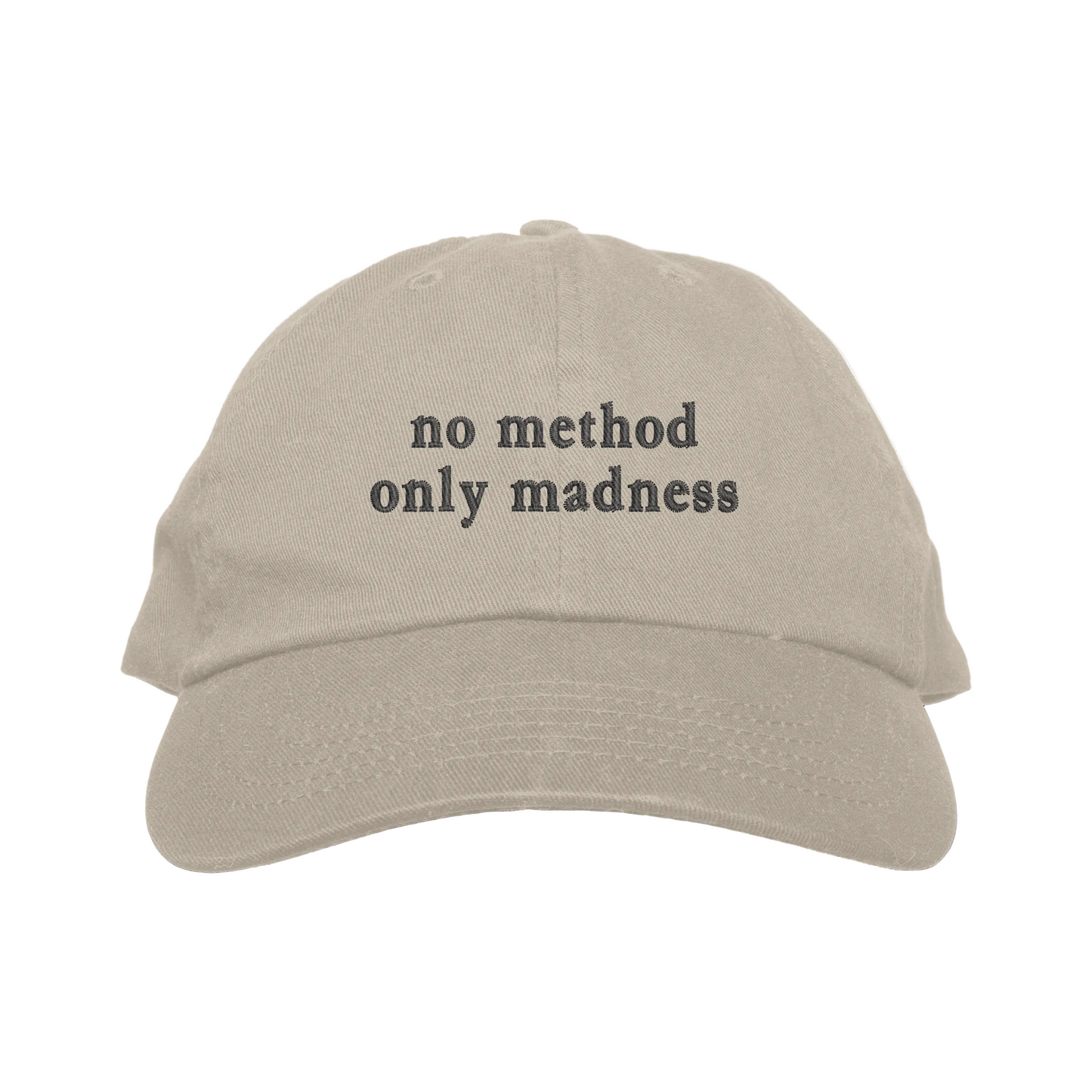Beige cap with 'no method only madness' text on a white background
