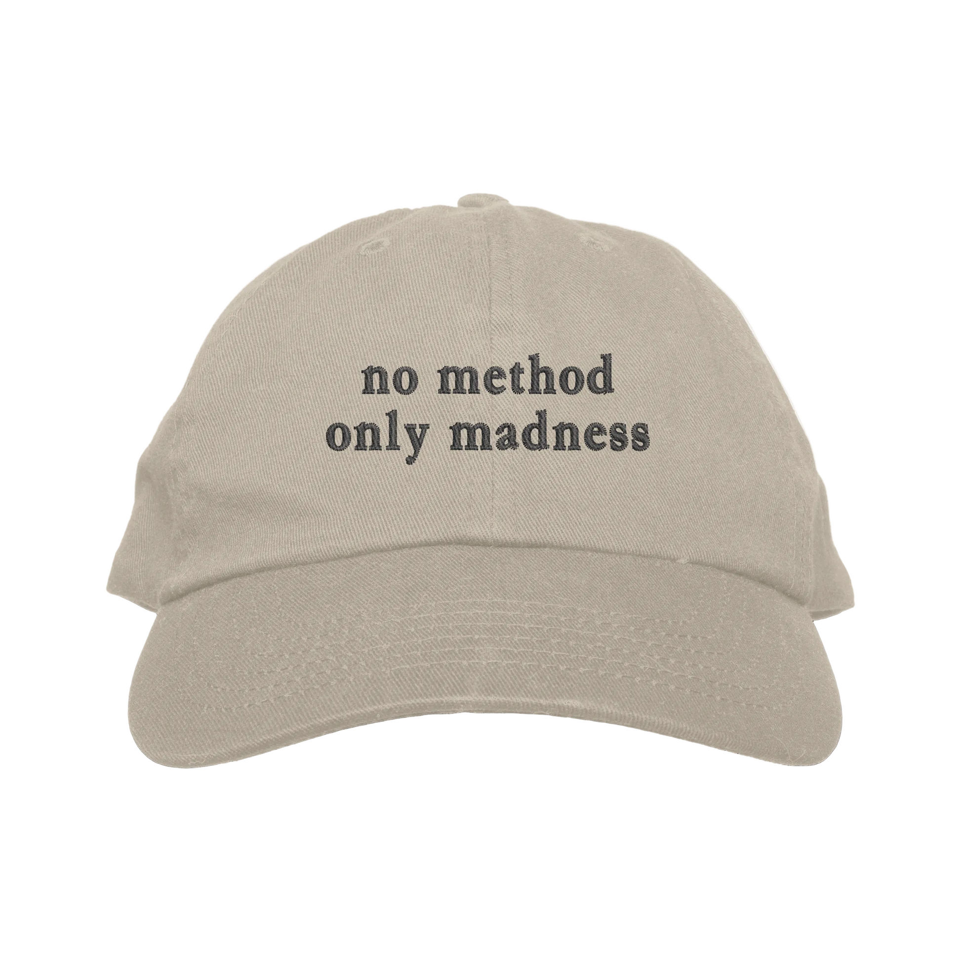 Beige cap with 'no method only madness' text on a white background